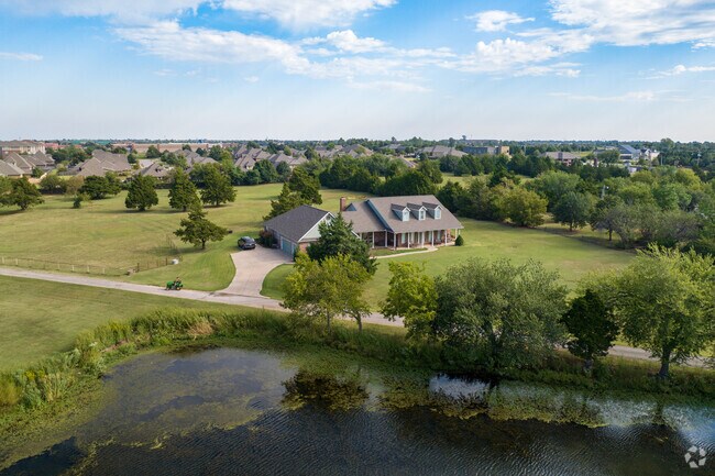A few of the Ketch Acres homes back up to a small lake in the area.