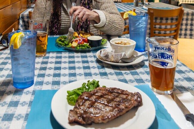 Blue Bay Seafood & Steaks provides a quaint atmosphere for surf and turf near Newfield.