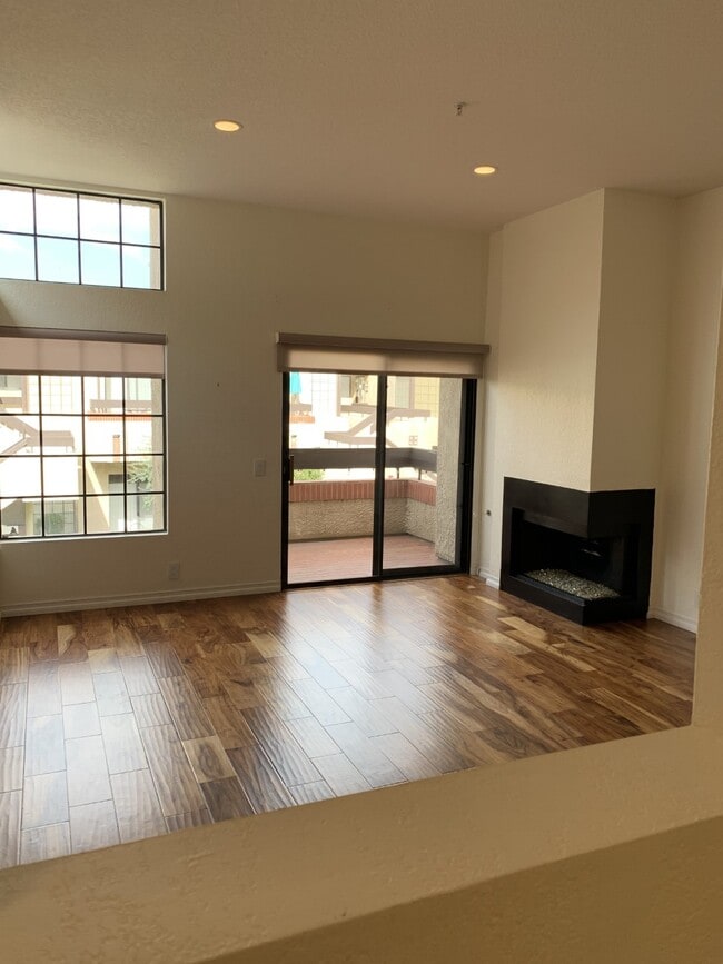 living room, balcony, fireplace facing north