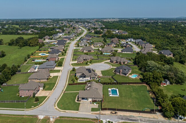 Some homes in Cave Springs have larger yards and pools.