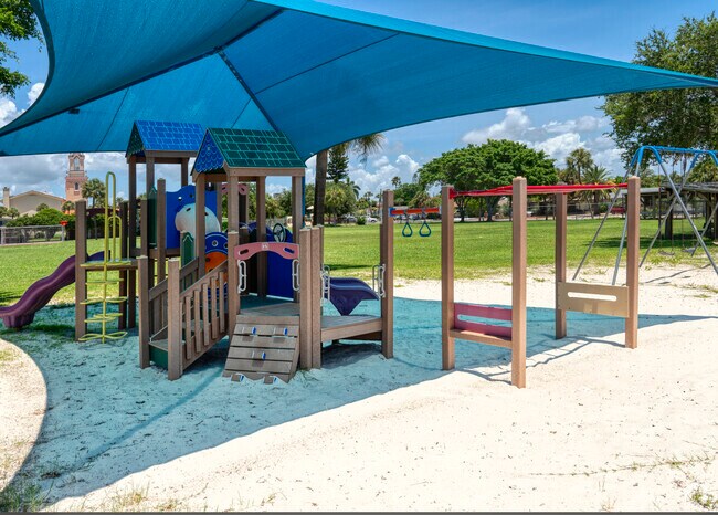 Students love playing in the sand and play equipment at St John Vianney Catholic School.