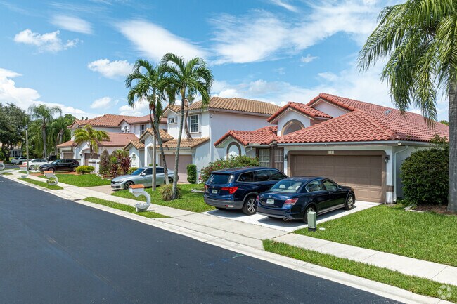 Spanish-style single-family homes are standard in the Holiday Springs neighborhood.