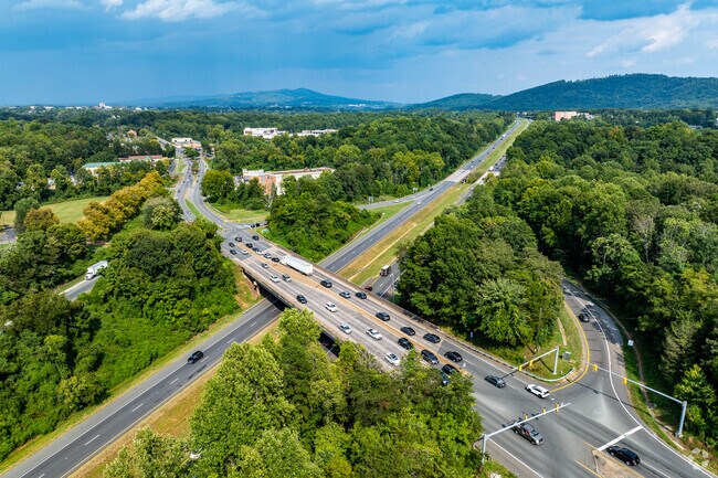 Interstate 64 curves across the northeast border, separating Redfields from downtown and UVA.