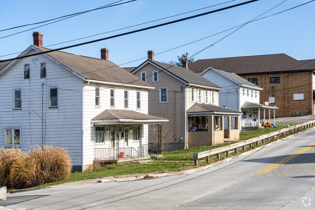 Colonial homes with front porches line quiet streets in Sewickley Township.