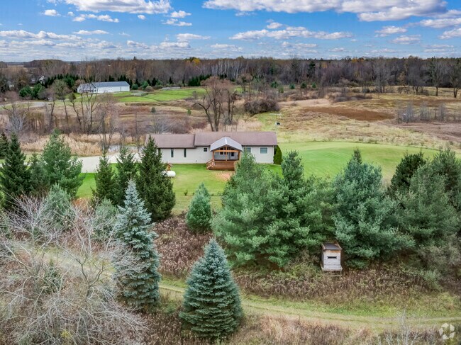 Modern ranch-style home with a tidy lawn in Burnside Township.