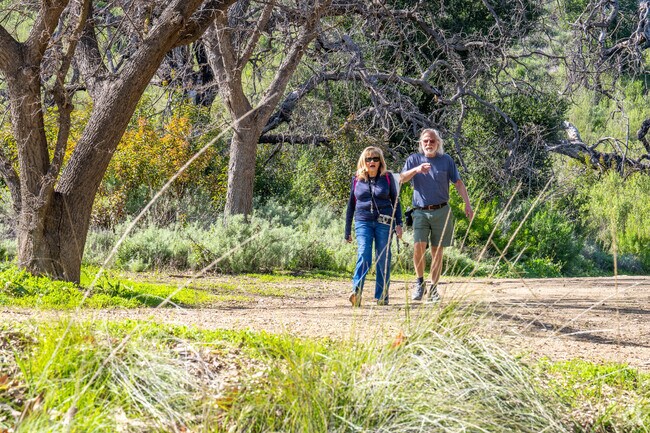 Hikers enjoy the shade of the trails around Oak Canyon Community Park.