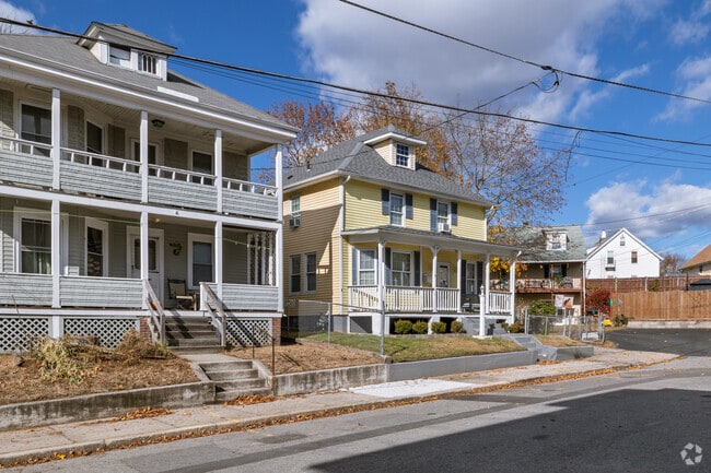 Large porches and dormers are common on North End multifamily homes.