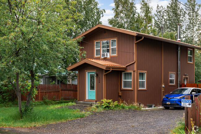 A cozy two-story home sits on a quiet street in the Aurora-Lemeta neighborhood.