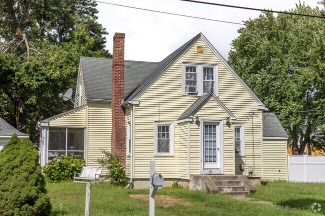 This idyllic cottage in the Oakland Beach neighborhood has a superb screened-in porch.