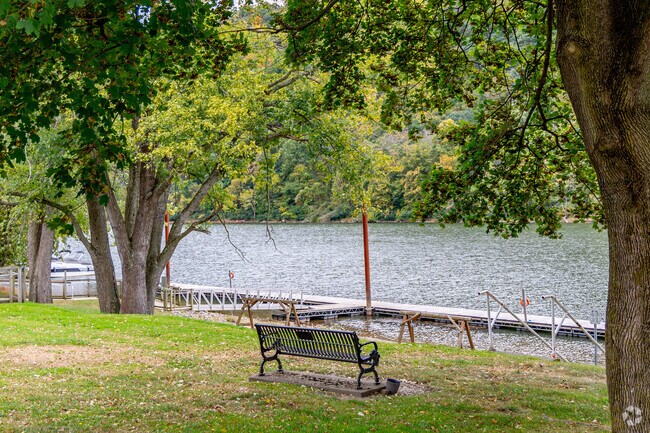 Riverside Park includes picnic tables and a public boat dock for visitors.