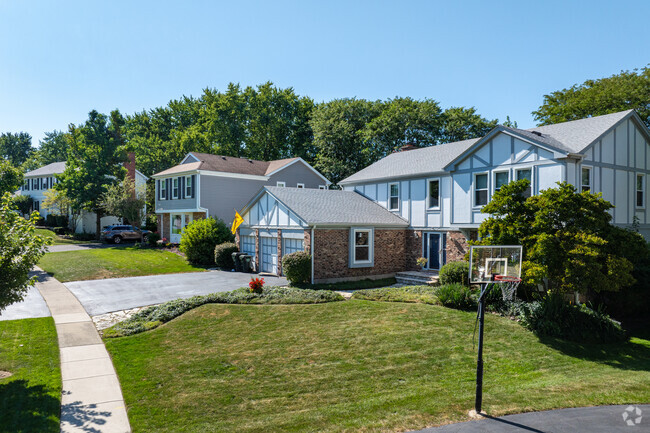 Some homes in Tullamore feature large yards with multi-car garages.