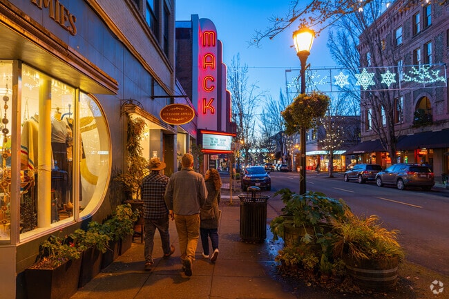 McMinnville locals shop and dine under the glow of the historic Mack Theater sign on 3rd Street.