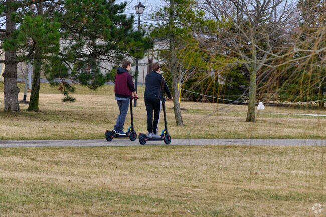 Walk, run, or scooter along the paved paths of Riverview’s Young Patriots Park.