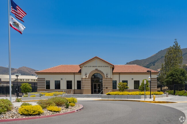 An American flag waves high above the entrance to San Luis Obispo High School.