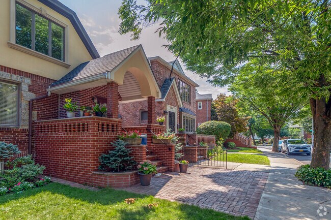 Homes in The Crescents have frond yards and narrow driveways on shady streets.