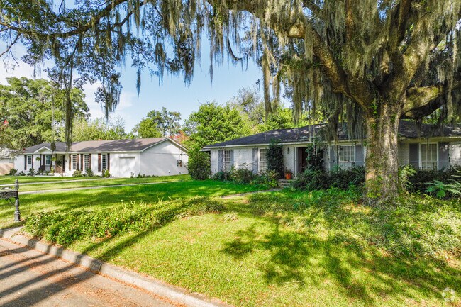 Mayfair Ranch homes are decorated with Spanish moss that drapes the trees.