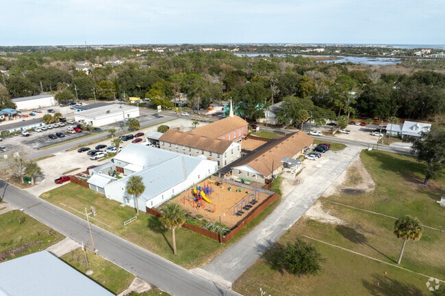 Students enjoy the swings and playground at Victory Preparatory School.
