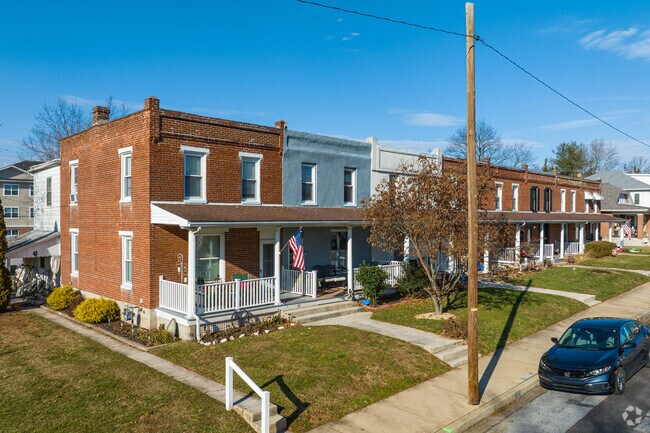 Two-story row homes typically have small front yards in Mount Wolf.