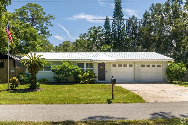 This Central Mainland home showcases a new metal roof and a proud American Flag.