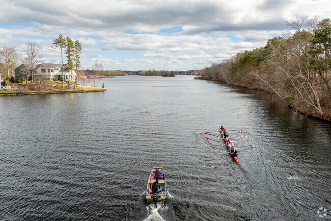 Students on the St. John's High School rowing team row down Lake Quinsigamond.