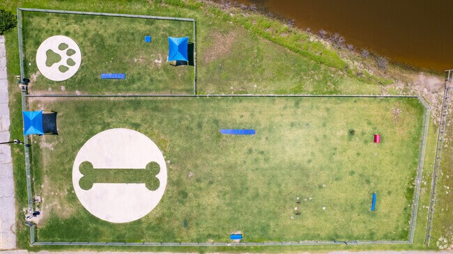 Furry friends enjoy the Community Park Dog Park on the bayside of Aransas Pass.