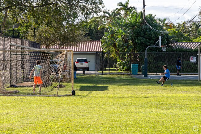 Residents play soccer at Biscayne Park.