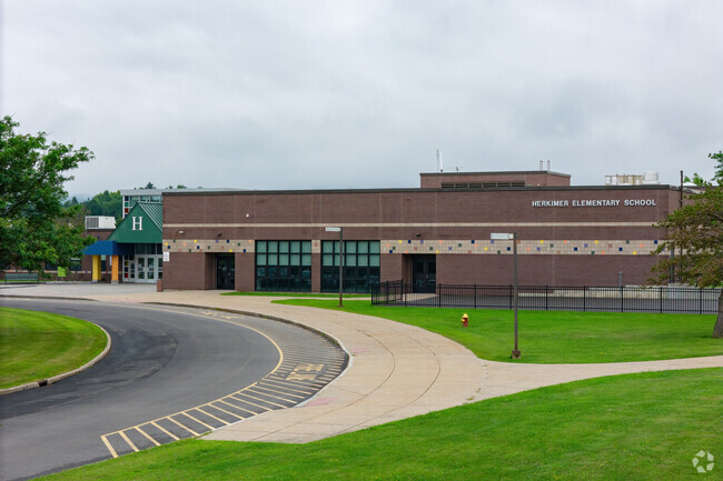 The bus entrance for Herkimer Elementary School is along a sweeping drive.
