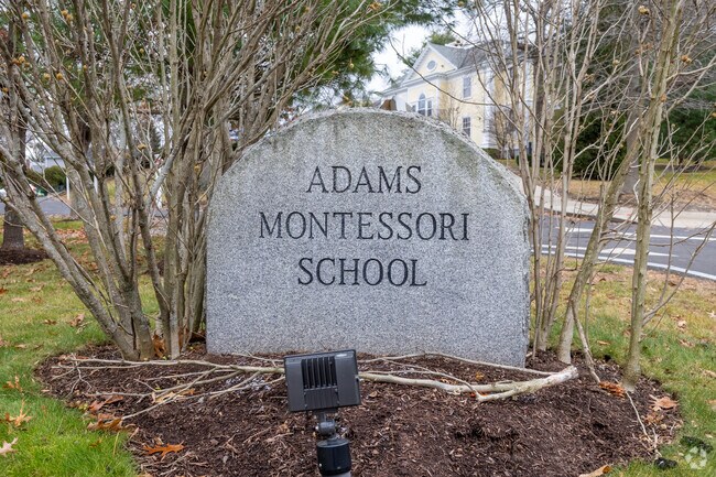A brilliant stone sign greets students as they enter the Adams Montessori School in Quincy.