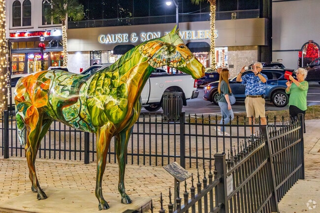A colorful mural covers a horse statue in historic downtown Ocala.