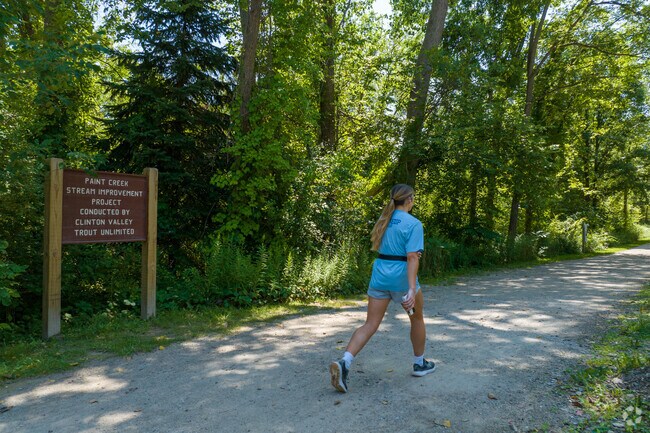 Bicyclists, runners and walkers enjoy the 9-mile-long Paint Creek Trail through Oakland.