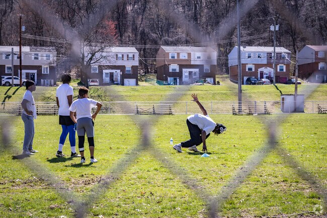 Kids help each other improve their skills practicing drills together at Chartiers Park.