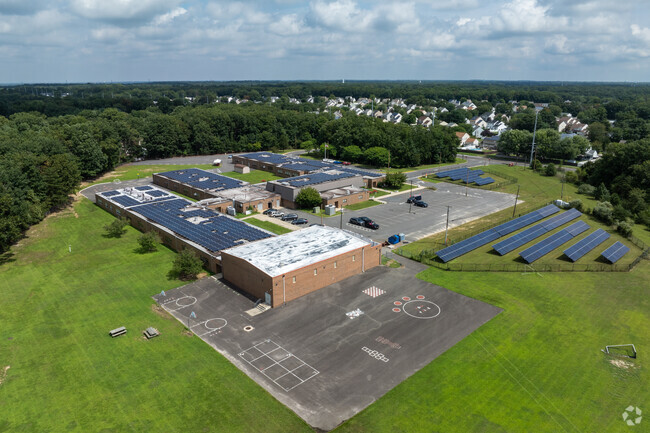 James W Lilley Jr Elementary School has a small schoolyard for their students to play at recess.