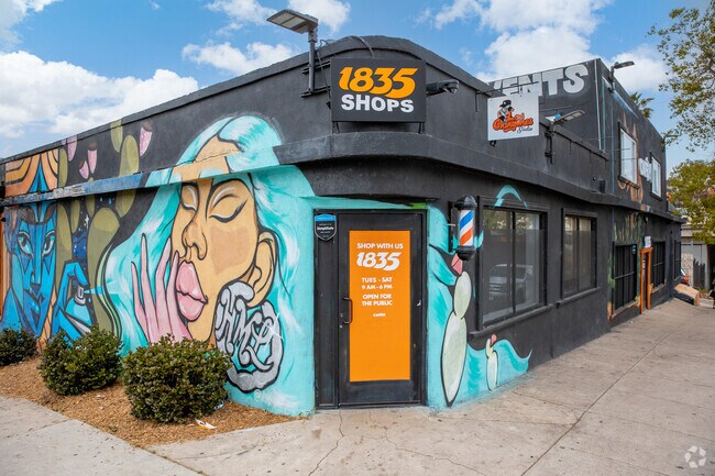 Many commercial buildings, such as the 1835 Shops, are painted with larger than life murals.