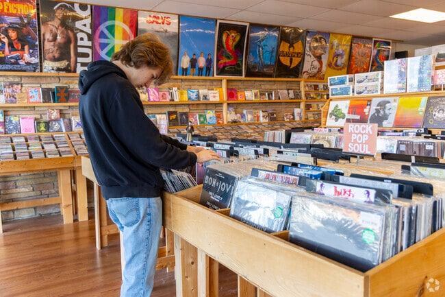 Customers at AFK Book & Records in Bayville explore eclectic collections of books and vinyl.