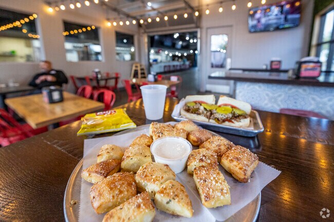 Locals from Mesquite Ranch visit Serial Grillers for shared plates and drinks.