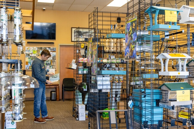 Millard Park residents find everything they need for bird watching in the back yard at the Wild Bird Habitat Store.