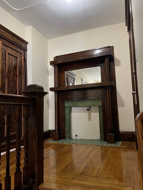 Stairs to second floor front hallway and front door