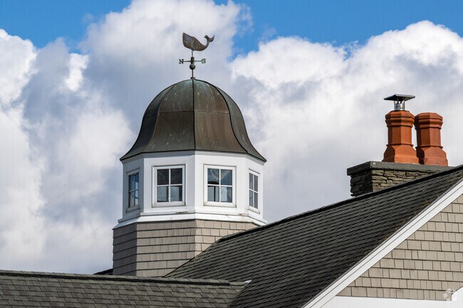 A whale of a weathervane graces the top of a cupola on a home in the Sachuest neighborhood.