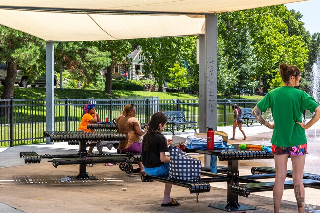 Relax in the shade and watch the kids play at Gillham Park.