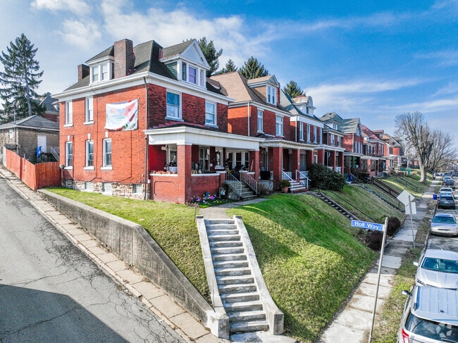 Brick homes with well-maintained front lawns are common throughout the Knoxville neighborhood.