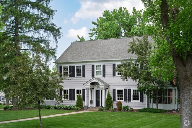 Larger colonial homes in Bluffside are well kept and stand out among the surrounding trees.