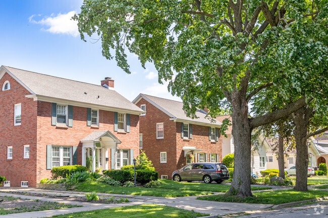 Rows of brick two-story homes, lined with mature trees, can be found in Near West Galena.
