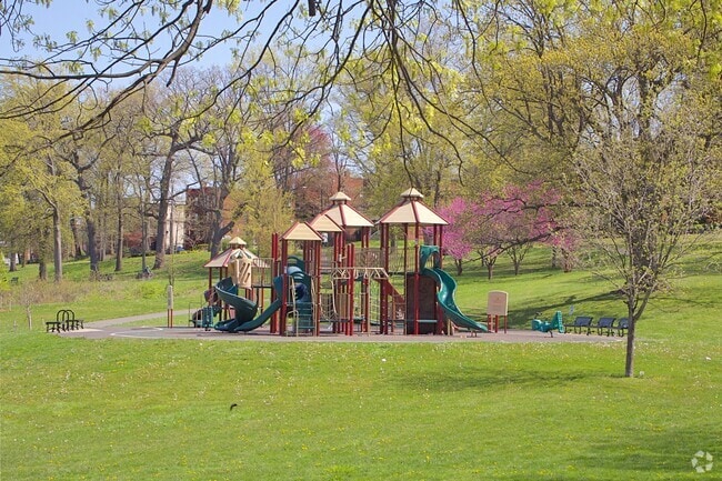 Pope Park's playground features multiple slides and seating.