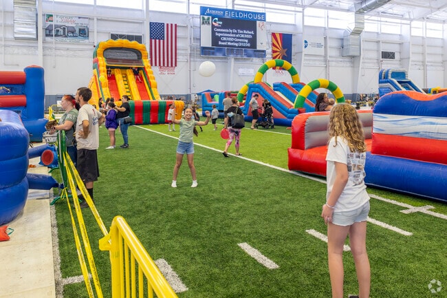 Kids play at the indoor play area during an event in the Anderson Filedhouse in Fort Mohave.