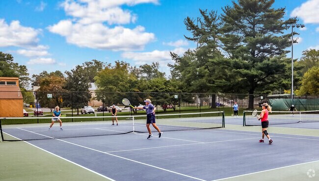Residents of West Bethesda play tennis on a Saturday afternoon.