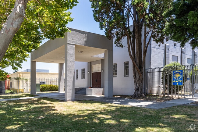 Yes Academy in Los Angeles, CA is recognized by its light gray building and tall pillars.