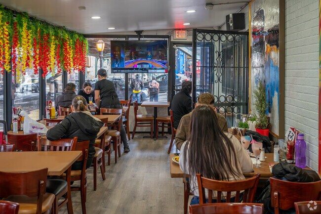 El Justine's dining area provides a nice view of the neighborhood in Concourse.