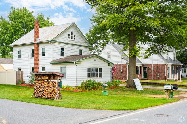 Residents sell firewood near their old water wells in Lexington.