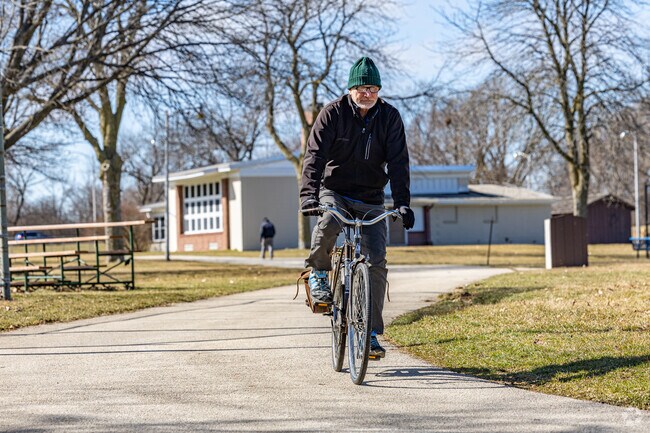 Saint Francis residents can enjoy a scenic bike ride through Nathaniel Greene Park, where paved paths and green space offer a peaceful escape.