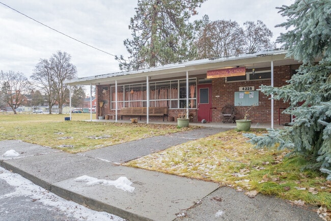 Windsong school features a modest brick building.